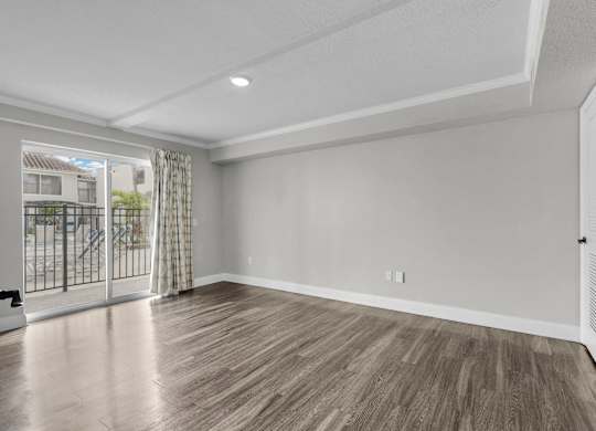 Room with attached balcony at Avia Apartments at Reedy Creek, Florida, 34747