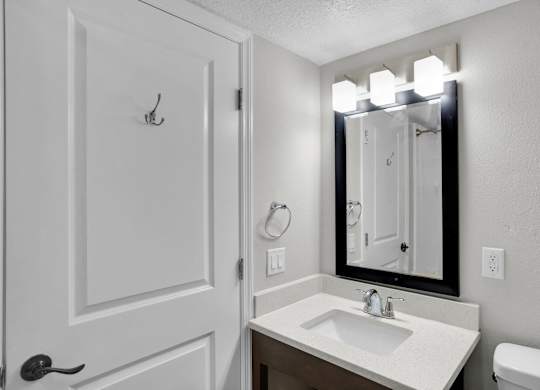 White bathroom at Avia Apartments at Reedy Creek, Kissimmee, Florida