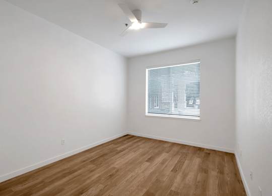 Room with ceiling fan at AVIA Apartments On Alpha, Dallas, Texas