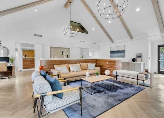 a living room with couches and a coffee table at AVIA Lofts on Liberty Ridge, Jacksonville, FL, 32256
