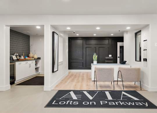 A black and white foyer with a rug that says