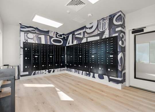 a large wall in a room with a filing cabinet and a desk at AVIA Lofts on Parkway Apartments, Washington