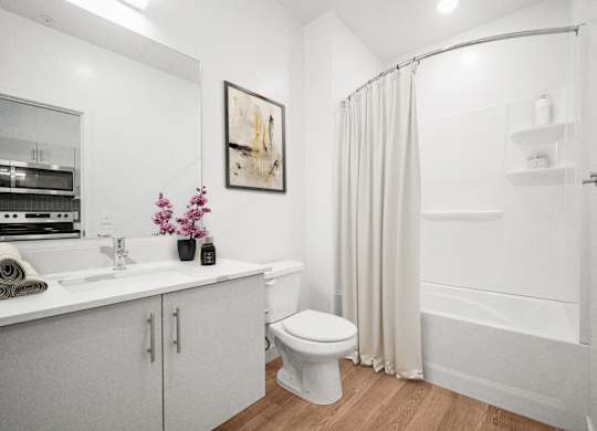 a bathroom with a shower and a sink and a toilet  at SevenO2 Main Apartments, Salt Lake City