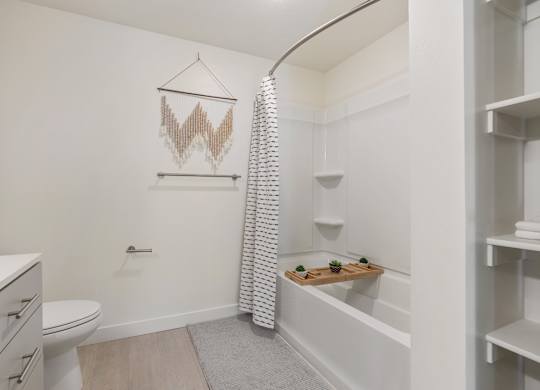 a bathroom with a shower and a toilet and a sink at Paperbox Lofts, Salt Lake City, UT