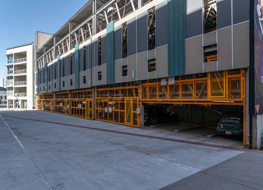 the side of a building with yellow scaffolding at Paperbox Lofts, Utah, 84101