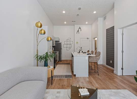 a living room and dining room with a couch and a table at SevenO2 Main Apartments, Salt Lake City, 84101