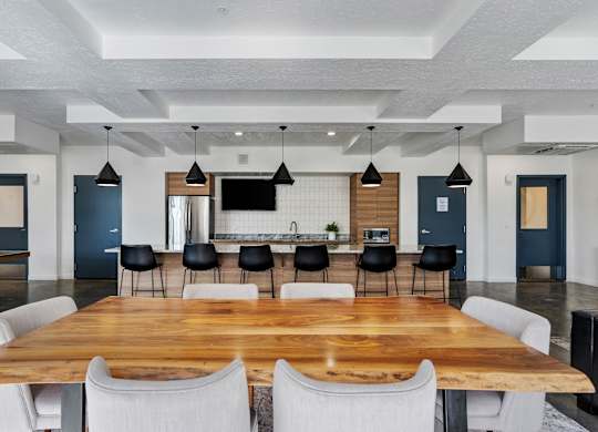 a large dining room with a large table and chairs at The Flats at Riverwoods, Provo, Utah