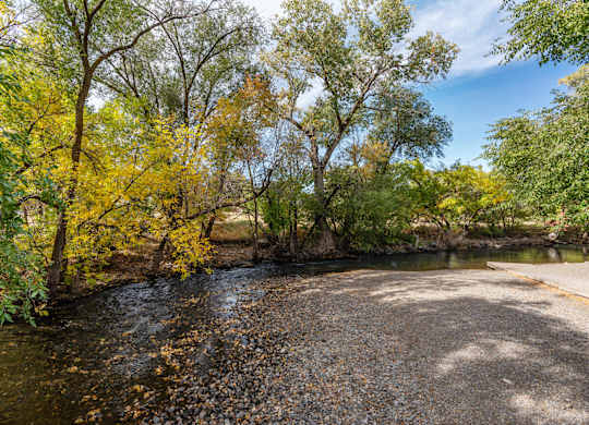 a river running through a park with treesat The View on 20th, Ogden, Utah