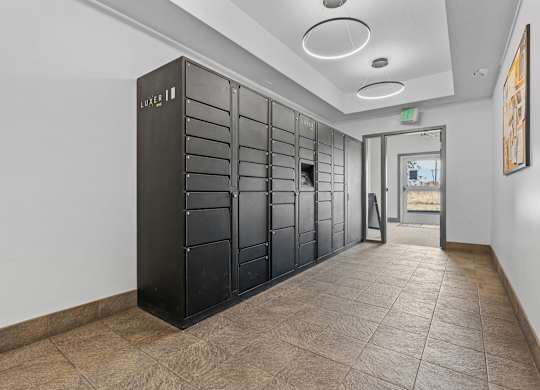 a long hallway with black lockers and a corridor with a doorat The View on 20th, Ogden, UT, 84401