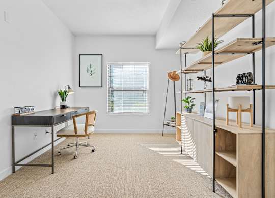 a home office with a desk and shelves and a windowat The View on 20th, Utah