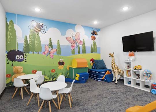 a room with a mural on the wall and a table and chairs in front of it at The Flats at Riverwoods, Provo