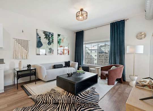 a living room with a couch and a coffee table at The Revival, Salt Lake City Utah