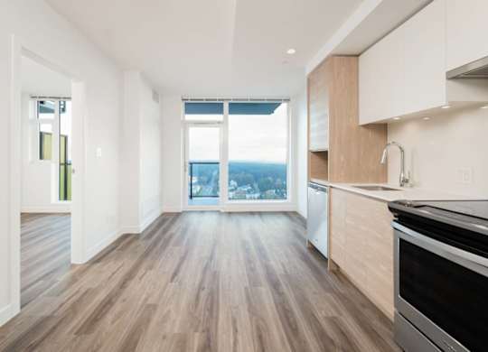 A kitchen with a stove top oven and a counter top.