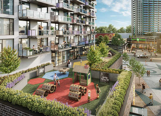 A playground area is surrounded by apartment buildings.