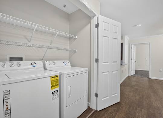 A laundry room with a washer and dryer.