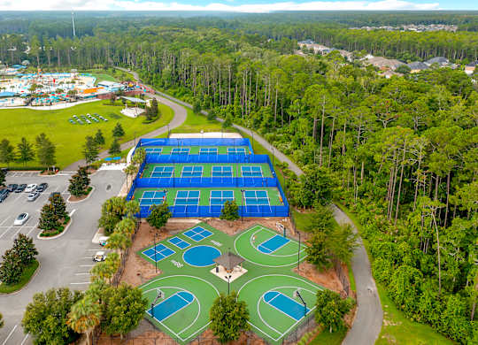 A large blue tarp covers a tennis court.