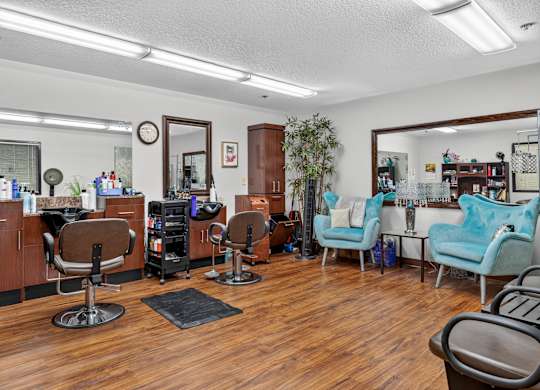 A room with wooden floors and a mirror on the wall.