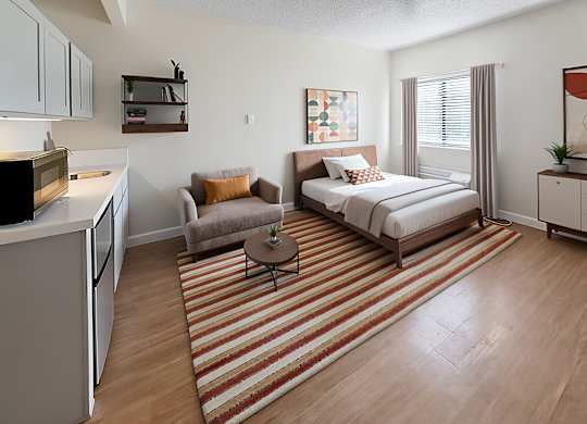 Studio apartment with kitchenette and bed at Lakeside Manor Apartments, Reno