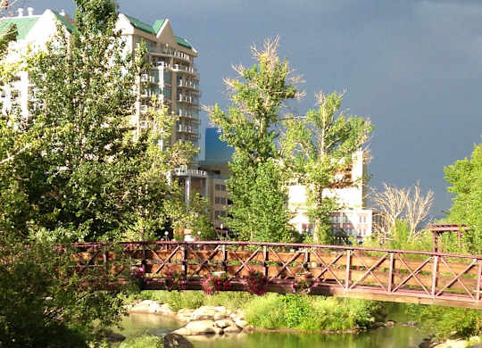 Pedestrian bridge over creek with landscaping at Lakeside Manor Apartments, Reno, NV