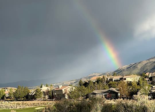 Rainbow over residential community and hillside at Lakeside Manor Apartments, Reno, 89509