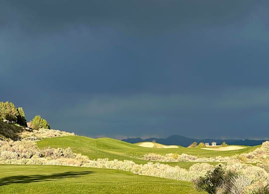 Golf course with rolling greens and mountains at Lakeside Manor Apartments, Reno, Nevada