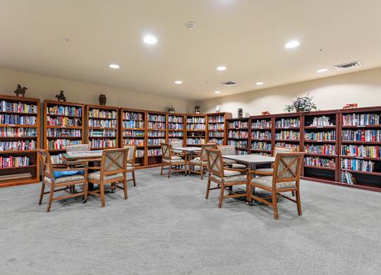 A library with bookshelves and tables.