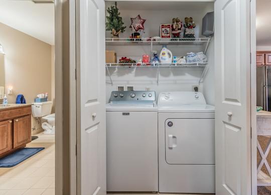 In unit laundry closet with washer and dryer at Schuyler Commons Apartments, Utica, New York