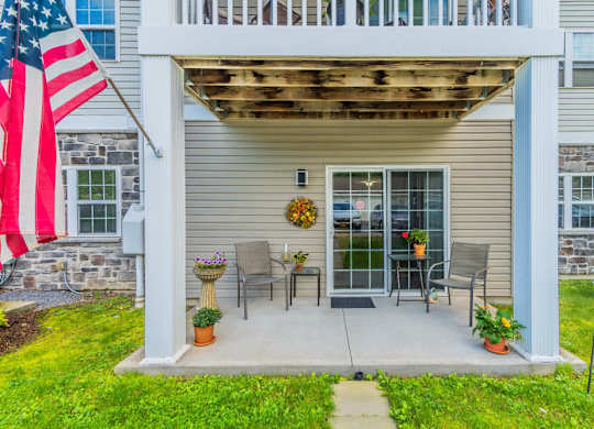 Private patio with pergola and outdoor furniture at Schuyler Commons Apartments, New York, 13502