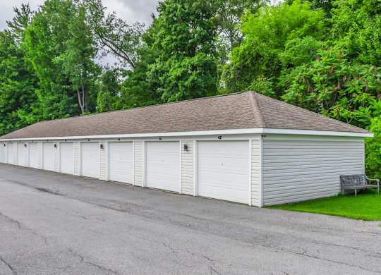 Row of white storage garages at Schuyler Commons Apartments, Utica, NY