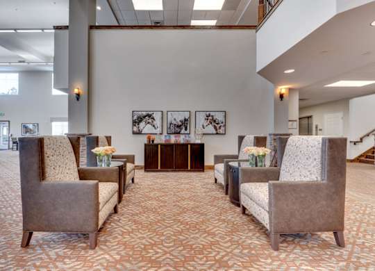 Modern lobby with horse artwork and seating at Mountain Lakes Estates Apartments, Reno, 89521