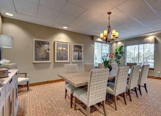 Conference room with chandelier and upholstered chairs at Mountain Lakes Estates Apartments, Nevada, 89521
