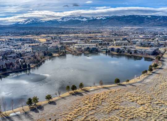 Aerial view of residential development with frozen lake at Mountain Lakes Estates Apartments, Nevada, 89521