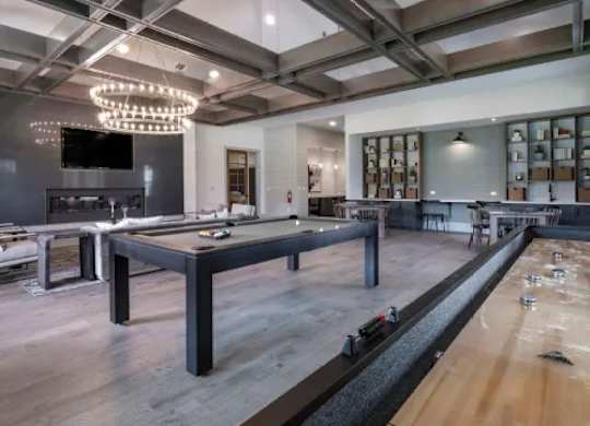 A billiard table with the number 1 on it is in the foreground of this image. at Atwater at Nocatee Apartments, Florida, 32081