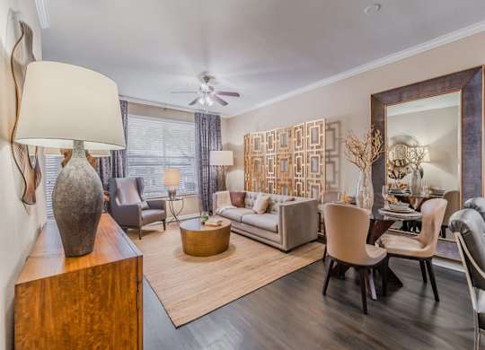 A living room with a large sculpture on a wooden table. at The Spring at Silverton Apartments, Fort Worth, Texas