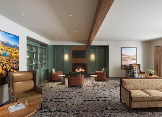 A living room with a fireplace and a couch commons area. DAS design and renderings.