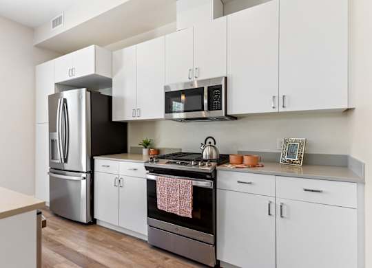 kitchen view with fridge, stove, and microwave at Edgeway Plaza, Rohnert Park California