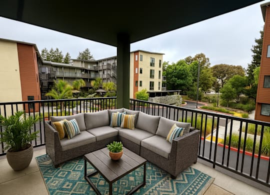 A patio with a couch and a coffee table.