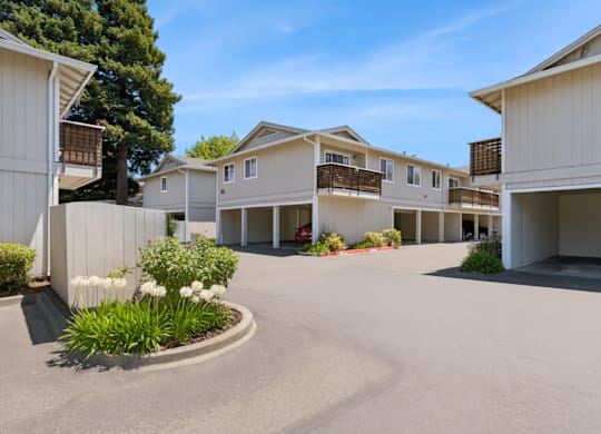 A sunny day at a residential complex with a clear blue sky.