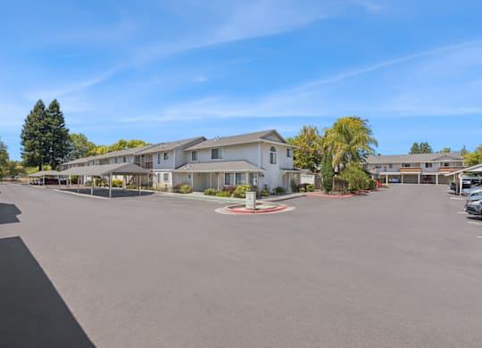 A sunny day at a residential complex with a clear blue sky.