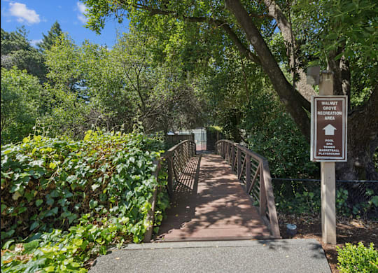 A bridge with a sign that says Walkway Recreation.