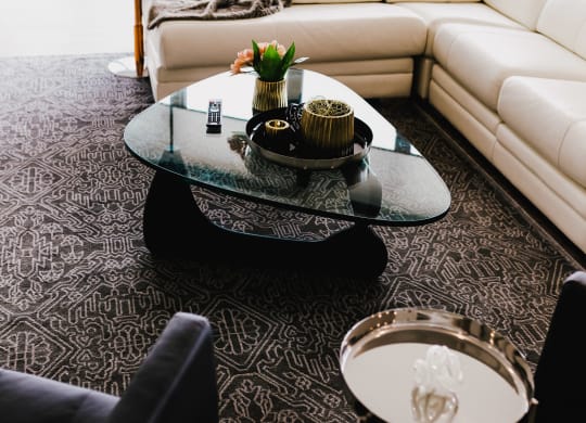 a living room with white couches and a coffee table