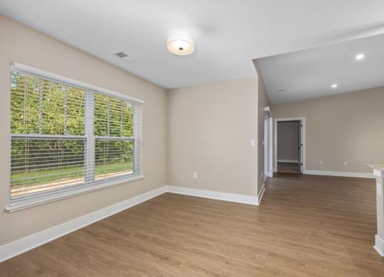 A room with a window and a door.