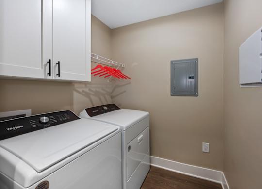 A laundry room with a washer and dryer.
