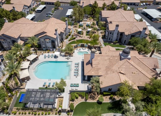 a birds eye view of a large mansion with a swimming pool