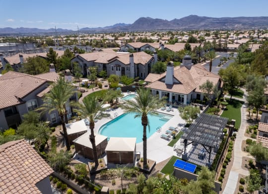 Aerial photo of the pool with cabanas, and grilling station at Cyan at Green Valley apartments in Henderson, Nevada.