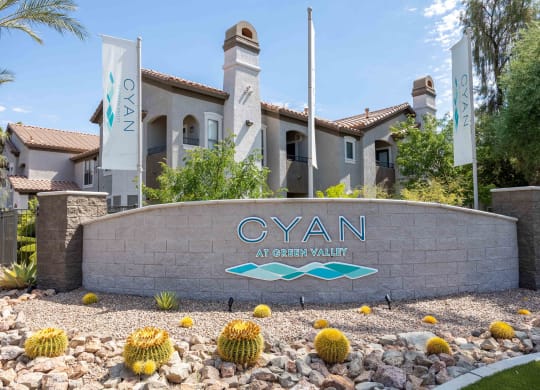 the cyan at green valley apartments sign in front of the building