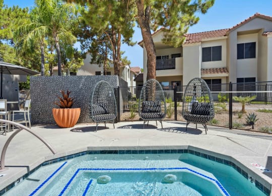 hot tub spa with outdoor chairs at hideaway apartments in north scottsdale