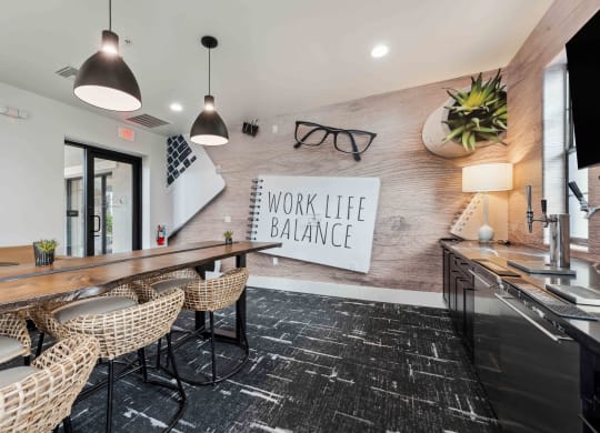 a conference room with a desk and chairs and a work life balance sign