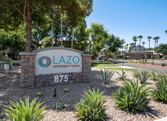 a sign with for lazo apartment homes logo