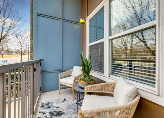 A private balcony with stylish furniture offered at Midtown 205, luxury partments, Charlotte, NC.